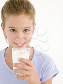 Royalty Free Photo of a Girl With a Glass of Milk