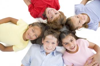 Royalty Free Photo of a Group of Children Lying in a Circle