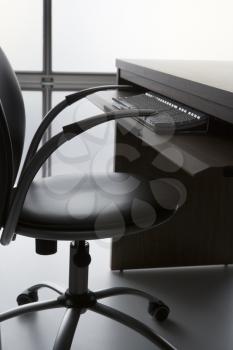 Royalty Free Photo of an Office Desk and Chair