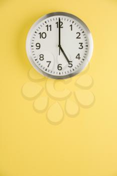 Royalty Free Photo of a Clock Showing Five