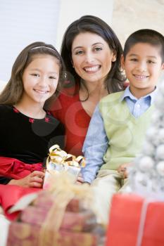 Royalty Free Photo of a Mother With Her Children at Christmas