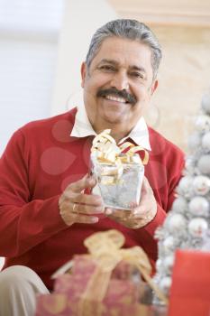 Royalty Free Photo of a Man With a Christmas Gift