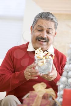 Royalty Free Photo of a Man With a Christmas Gift