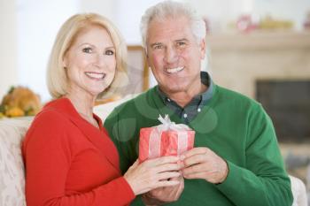 Royalty Free Photo of a Man Giving a Wife a Gift