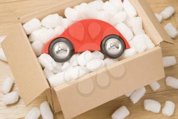 Royalty Free Photo of a Toy Car in a Box