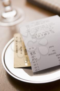 Royalty Free Clipart Image of Paying a Restaurant Bill With a Card