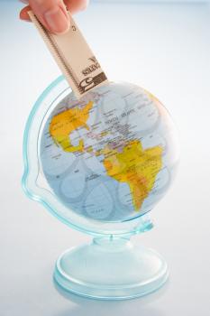 Royalty Free Photo of a Bank Note and a Globe
