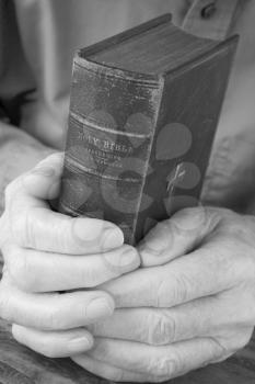 Royalty Free Photo of Hands Holding a Bible