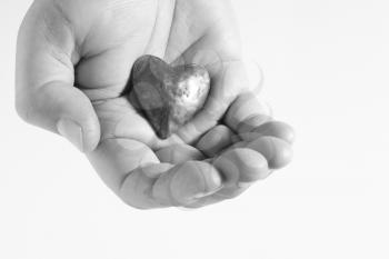 Royalty Free Photo of a Heart in a Hand