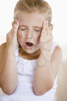 Royalty Free Photo of a Little Girl With a Headache