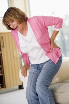 Royalty Free Photo of a Woman With Back Pain