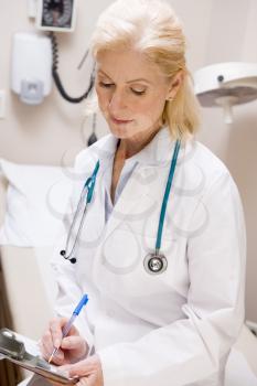 Royalty Free Photo of a Female Doctor With a Clipboard