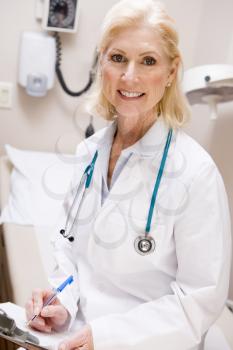 Royalty Free Photo of a Female Doctor With a Clipboard