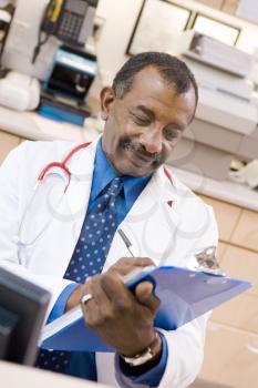 Royalty Free Photo of a Doctor With a Clipboard