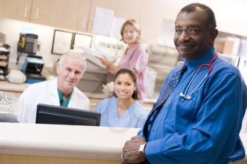 Royalty Free Photo of Doctors and Nurses at the Reception Area