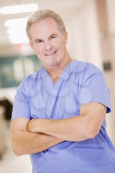 Royalty Free Photo of a Doctor Standing in a Hospital