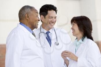 Royalty Free Photo of Three Doctors Talking