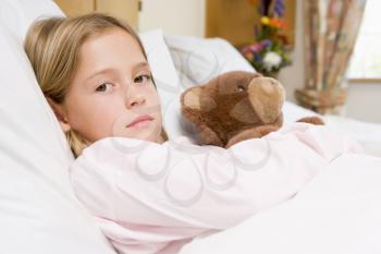 Royalty Free Photo of a Little Girl in the Hospital With a Teddy Bear
