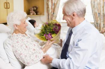 Royalty Free Photo of a Man Visiting His Wife in the Hospital