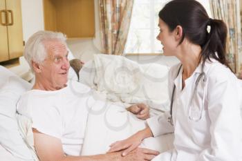 Royalty Free Photo of a Doctor Talking to a Patient