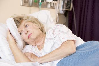 Royalty Free Photo of a Woman Lying in a Hospital Bed