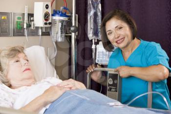 Royalty Free Photo of a Nurse With a Patient in the Hospital