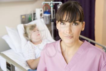 Royalty Free Photo of a Nurse in a Patient's Room