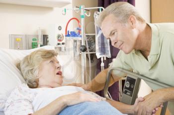 Royalty Free Photo of a Man Visiting His Mother in the Hospital