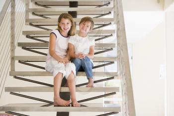 Royalty Free Photo of Two Little Girls on a Staircase