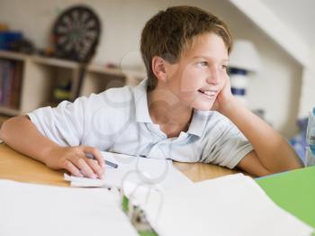 Royalty Free Photo of a Boy Doing His Homework