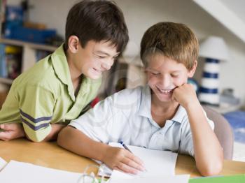 Royalty Free Photo of Two Boys Doing Homework