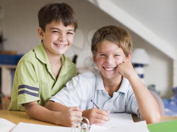 Royalty Free Photo of Two Boys Doing Homework