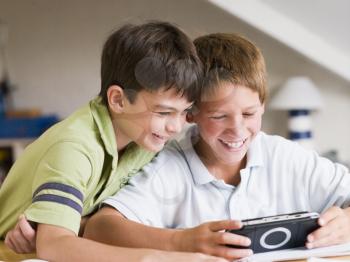 Royalty Free Photo of Two Boys With a Video Game