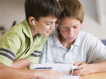 Royalty Free Photo of Two Boys With an Mp3 Player
