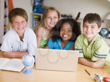 Royalty Free Photo of a Group of Children With a Laptop