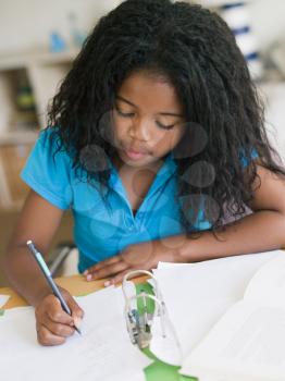 Royalty Free Photo of a Young Girl Doing Her Homework