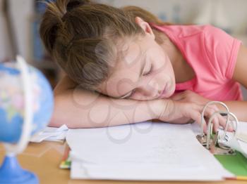 Royalty Free Photo of a Girl Asleep on Her Homework