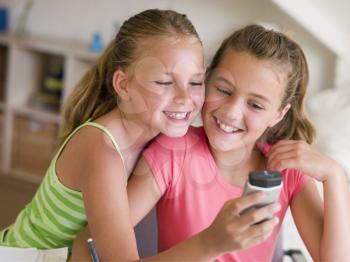 Royalty Free Photo of Two Girls With a Cellphone