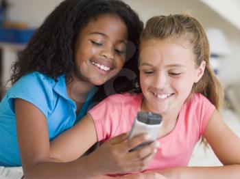 Royalty Free Photo of Two Girls With a Cellphone
