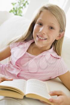 Royalty Free Photo of a Girl Reading a Book