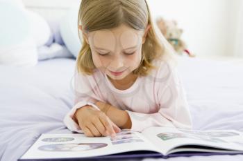 Royalty Free Photo of a Young Girl Reading a Book