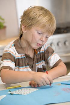 Royalty Free Photo of a Boy Drawing Pictures