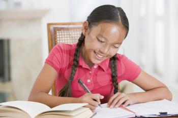 Royalty Free Photo of a Girl Doing Her Homework
