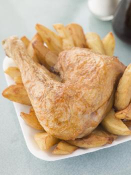 Royalty Free Photo of Chicken and Chips on a Styrofoam Tray