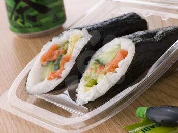 Royalty Free Photo of Hand Moulded Sushi With A Can Of Green Tea