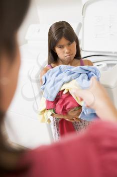 Royalty Free Photo of a Girl Doing Laundry