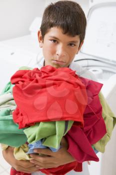 Royalty Free Photo of a Boy With Laundry