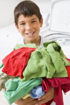 Royalty Free Photo of a Boy With Laundry
