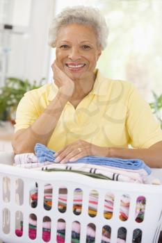 Royalty Free Photo of a Woman With a Laundry Basket