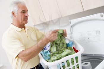 Royalty Free Photo of a Man Doing Laundry